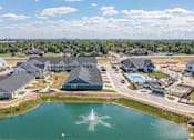 Thumbnail 7 of 31 - A large building complex with a fountain in the foreground.
