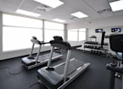Thumbnail 31 of 36 - Fitness Center at Living room at Southfield MI Apartments | 42 West Apartments in Southfield Michigan