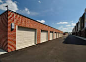 Thumbnail 27 of 36 - Garages at Living room at Southfield MI Apartments | 42 West Apartments in Southfield Michigan