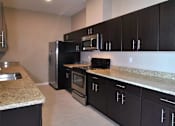 Thumbnail 7 of 36 - Kitchen at Living room at Southfield MI Apartments | 42 West Apartments in Southfield Michigan