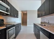 Thumbnail 10 of 36 - Kitchen at Living room at Southfield MI Apartments | 42 West Apartments in Southfield Michigan