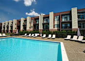 Thumbnail 35 of 36 - Swimming pool at Living room at Southfield MI Apartments | 42 West Apartments in Southfield Michigan