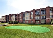 Thumbnail 33 of 36 - Putting green at Living room at Southfield MI Apartments | 42 West Apartments in Southfield Michigan