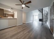 Thumbnail 13 of 23 - Dining area and staircase at Alpine Slopes Apartments near Grand Rapids, MI