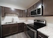 Thumbnail 2 of 23 - Spacious kitchen at Alpine Slopes Apartments near Grand Rapids, MI