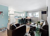 Thumbnail 1 of 24 - Spacious living area and kitchen at Abbott Pointe Apartments in East Lansing, MI near Michigan State University