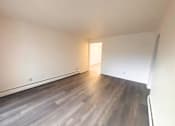 Thumbnail 2 of 7 - Lansing Apartments living room with vinyl plank floor