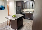 Thumbnail 1 of 8 - A spacious kitchen at apartments in East Lansing near Michigan State University | Americana Apartments in East Lansing, Michigan