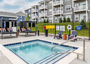 Thumbnail 35 of 47 - Pool, hot tub and pool deck at apartments in Traverse City | Bayview of Traverse City