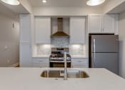 Thumbnail 22 of 47 - Kitchen in apartments in Traverse City | Bayview of Traverse City