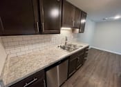 Thumbnail 4 of 27 - Kitchen at Briarlane Apartments in Grand Rapids, MI