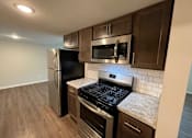 Thumbnail 5 of 27 - Kitchen at Briarlane Apartments in Grand Rapids, MI