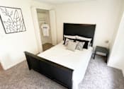 Thumbnail 21 of 22 - a bedroom with a large bed and a closet