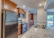 Thumbnail 2 of 24 - Kitchen in East Lansing Apartment near MSU | Delta Arms Apartments