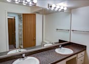 Thumbnail 19 of 24 - a bathroom with two sinks and a large mirror