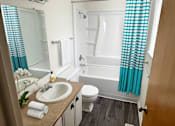 Thumbnail 4 of 12 - a bathroom with a sink toilet and bath tub