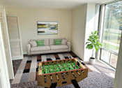Thumbnail 3 of 12 - a living room with a pool table and a couch