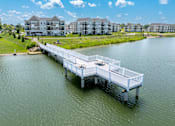 Thumbnail 35 of 43 - Private lake and dock at Hudsonville, MI Apartments and Townehomes | Elmwood Lake Apartments in Hudsonville MI