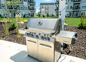 Thumbnail 34 of 43 - Grill stations available at Hudsonville, MI Apartments and Townehomes | Elmwood Lake Apartments in Hudsonville MI