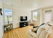 Thumbnail 13 of 43 - Living room in townhome at Elmwood Lake Apartments in Hudsonville MI