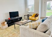 Thumbnail 9 of 43 - Living room in townhome at Elmwood Lake Apartments in Hudsonville MI