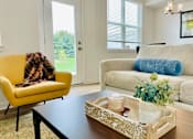 Thumbnail 12 of 43 - Living room in townhome at Elmwood Lake Apartments in Hudsonville MI
