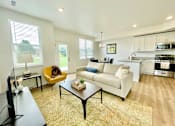 Thumbnail 10 of 43 - Living room in townhome at Elmwood Lake Apartments in Hudsonville MI