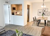 Thumbnail 10 of 34 - a living room and dining room in a two bedroom apartment