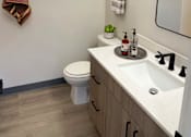 Thumbnail 14 of 34 - a small bathroom with a toilet sink and mirror