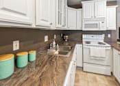 Thumbnail 1 of 26 - Spacious Kitchen in East Lansing Apartments near Michigan State University | Glenwood