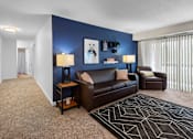 Thumbnail 2 of 26 - Spacious Living Room in East Lansing Apartments near Michigan State University | Glenwood
