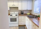 Thumbnail 9 of 9 - Spacious Kitchen in East Lansing Apartments near Michigan State University | Holiday Townhomes