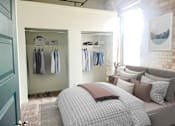 Thumbnail 3 of 26 - a bedroom with a bed and a closet