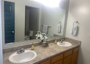 Thumbnail 8 of 26 - a bathroom with two sinks and a large mirror