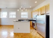Thumbnail 14 of 50 - a kitchen with an island in the middle of the room