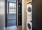 Thumbnail 12 of 50 - a washer and dryer in a laundry room with a window