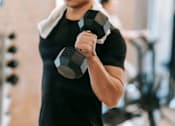 Thumbnail 45 of 47 - Resident working out at Royal Oak, MI Apartments | Main Living Apartments in Royal Oaks, MI