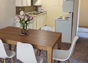 Thumbnail 2 of 19 - Kitchen and dining at Mason Hills Apartments in Mason, MI