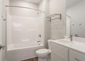 Thumbnail 26 of 53 - Bathroom with tub and shower at apartments in Haslett, Michigan | Newton Place Apartments in Haslett MI