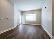 Thumbnail 17 of 53 - Spacious living room at Haslett MI Apartments | Newton Place Apartments in Haslett, MI