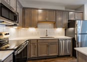 Thumbnail 10 of 53 - Kitchen at Haslett MI Apartments | Newton Place Apartments in Haslett, MI