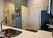 Thumbnail 6 of 53 - Kitchen at Haslett MI Apartments | Newton Place Apartments in Haslett, MI