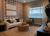 Thumbnail 2 of 53 - Living room at Haslett MI Apartments | Newton Place Apartments in Haslett, MI