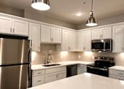 Thumbnail 16 of 53 - Kitchen at apartments in Haslett, Michigan | Newton Place Apartments in Haslett MI
