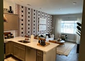 Thumbnail 3 of 53 - Spacious living room and kitchen at Newton Place Apartments in Haslett, Michigan