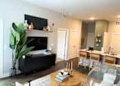 Thumbnail 7 of 53 - Spacious living room and kitchen at Newton Place Apartments in Haslett, Michigan