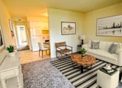Thumbnail 2 of 15 - Living room at Okemos Village Apartments
