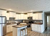 Thumbnail 3 of 29 - Open concept kitchen at Pine Lane Estates Apartments in Lansing, MI