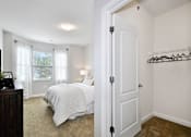 Thumbnail 10 of 26 - a bedroom with a bed and a window