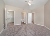 Thumbnail 11 of 26 - an empty bedroom with a ceiling fan